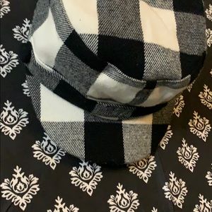 Checkered train conductor hat.